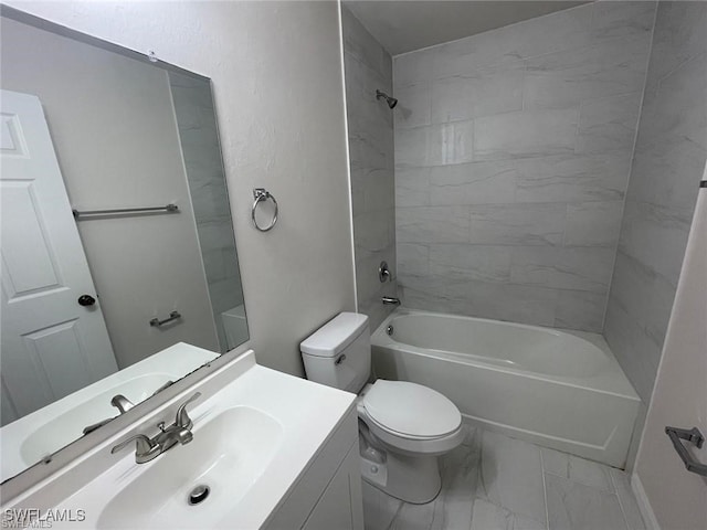 full bathroom with vanity, toilet, and tiled shower / bath