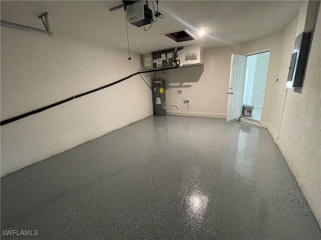 garage with water heater and a garage door opener