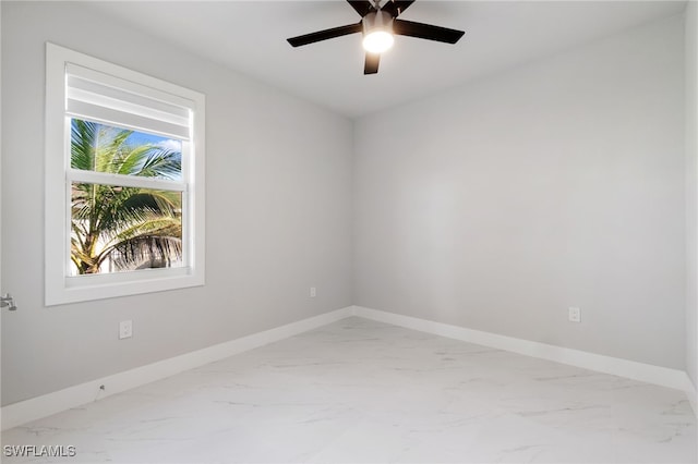 spare room with ceiling fan