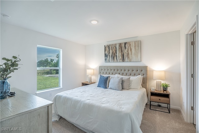 bedroom with light carpet