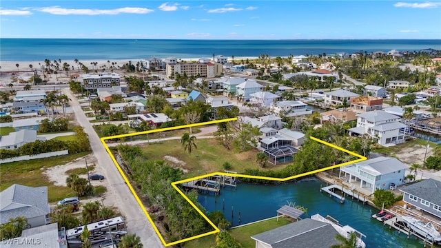 bird's eye view featuring a water view and a residential view