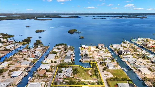 drone / aerial view featuring a water view and a residential view