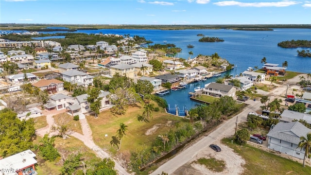 aerial view with a water view and a residential view