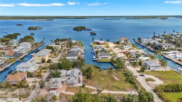 bird's eye view featuring a water view and a residential view