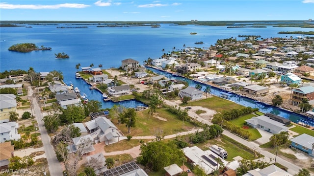 birds eye view of property featuring a water view and a residential view