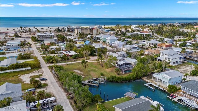 bird's eye view featuring a water view and a residential view