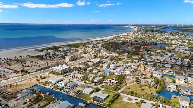 aerial view featuring a water view and a view of the beach