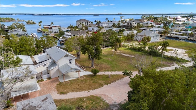 birds eye view of property featuring a water view and a residential view