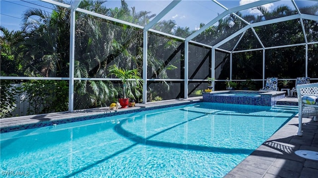 view of pool featuring a lanai and a pool with connected hot tub