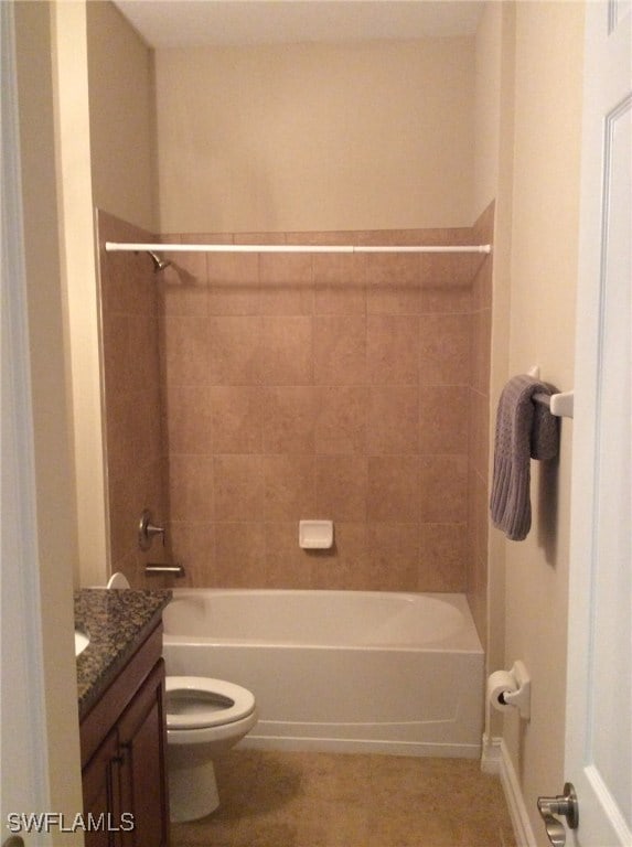 full bathroom with toilet, tiled shower / bath combo, and vanity