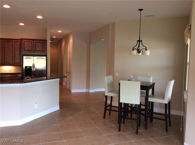 dining area with light tile patterned flooring