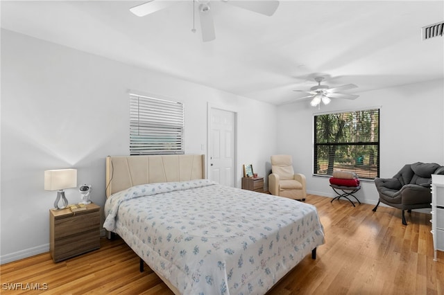 bedroom featuring hardwood / wood-style floors and ceiling fan