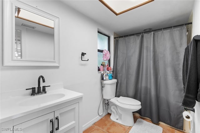 bathroom featuring vanity, toilet, tile patterned flooring, and a shower with curtain