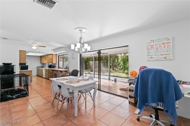 dining area featuring light tile patterned floors and ceiling fan with notable chandelier