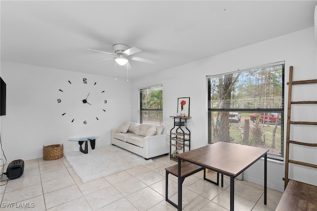 living room with light tile patterned floors and ceiling fan