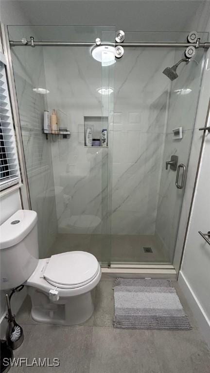 full bathroom with toilet and a shower stall