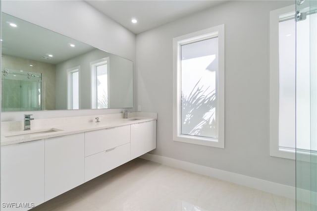 bathroom with vanity and walk in shower