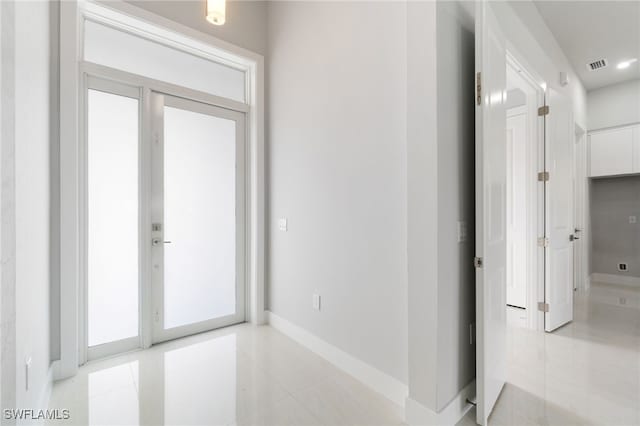 corridor with light tile patterned floors