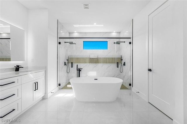 bathroom featuring vanity, tile walls, and independent shower and bath