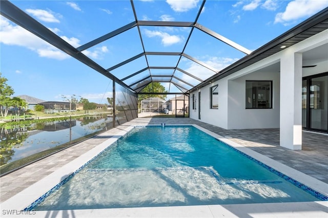 pool with a lanai, a water view, and a patio