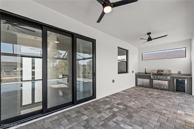 view of patio / terrace with ceiling fan, grilling area, and area for grilling