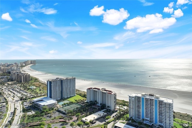 bird's eye view featuring a view of the beach and a water view