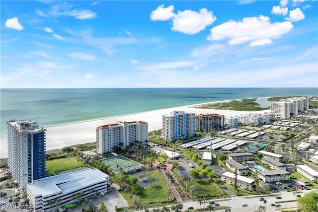 birds eye view of property featuring a view of the beach and a water view