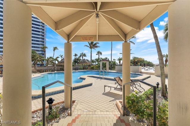 view of swimming pool with a patio area