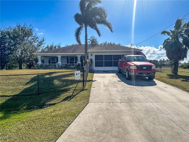 single story home with a garage and a front lawn