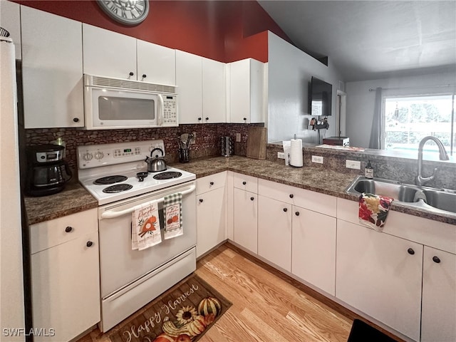 kitchen featuring light hardwood / wood-style floors, white cabinetry, sink, white appliances, and decorative backsplash