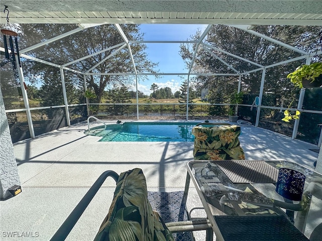 view of pool with a lanai and a patio area