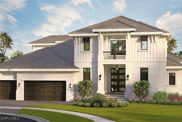 view of front facade featuring a garage and a front yard