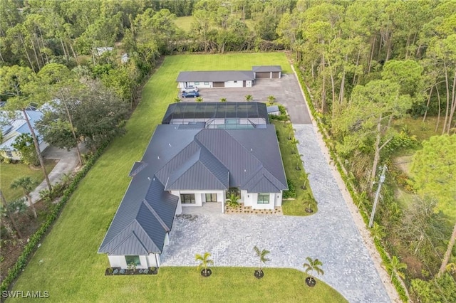 1125 Oakes Blvd, Naples, FL 34119 - view from above of property with a heavily wooded area