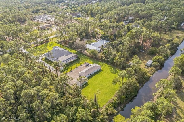 1125 Oakes Blvd, Naples, FL 34119 - aerial view of property and surrounding area featuring a nearby body of water and a forest
