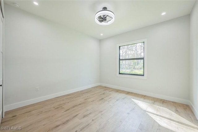 unfurnished room with light hardwood / wood-style flooring