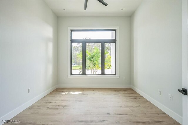 unfurnished room featuring ceiling fan and light wood-type flooring