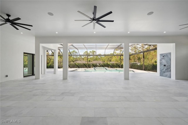 interior space with ceiling fan and a lanai