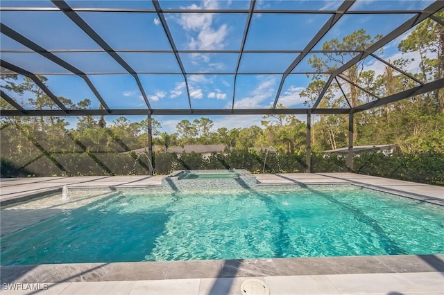 view of pool featuring pool water feature and glass enclosure