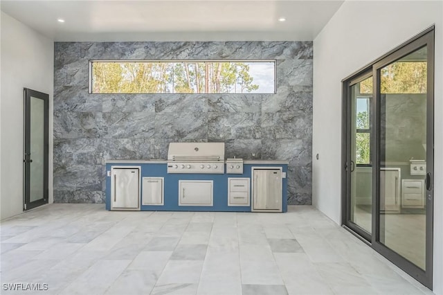 interior space with tile walls and a wealth of natural light