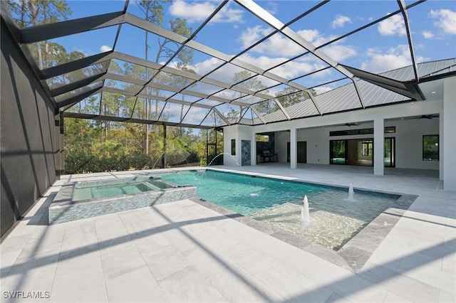 view of swimming pool featuring ceiling fan, a lanai, pool water feature, and a patio