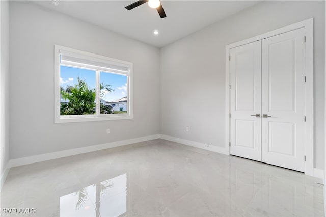 unfurnished bedroom with a closet and ceiling fan