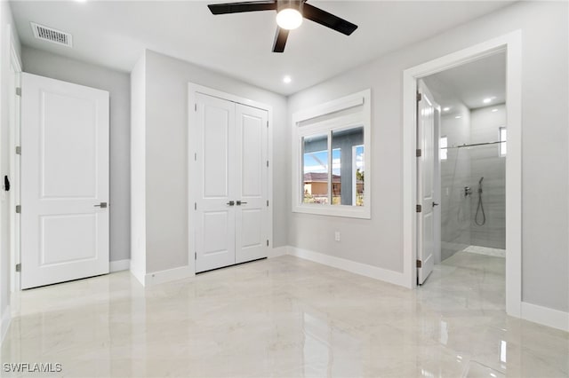 unfurnished bedroom with ceiling fan and a closet