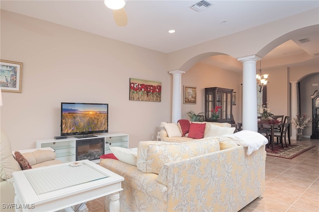 tiled living room featuring ornate columns