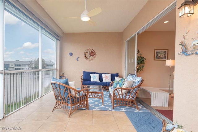 sunroom featuring ceiling fan