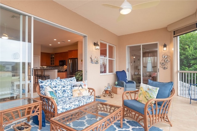 sunroom / solarium with ceiling fan