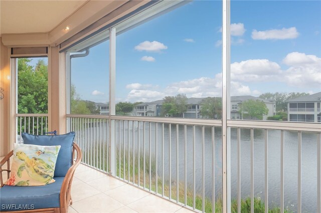 sunroom with a water view