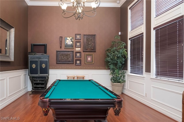 playroom featuring crown molding, wood-type flooring, pool table, and an inviting chandelier