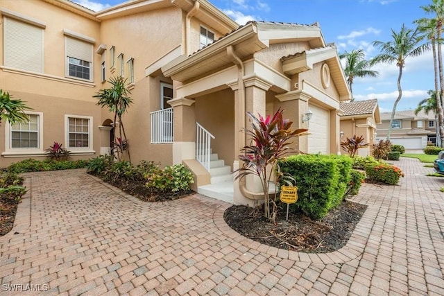 doorway to property featuring a garage