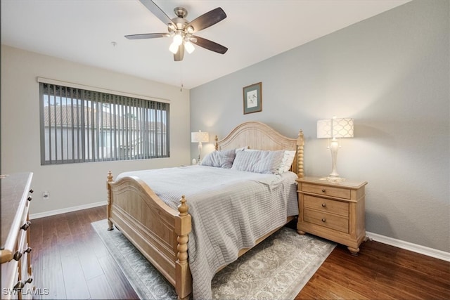 bedroom featuring ceiling fan and dark wood-type flooring