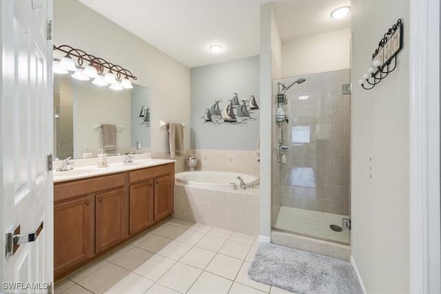 bathroom with vanity, tile patterned floors, and independent shower and bath